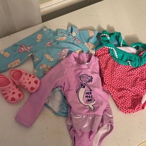 3 Swimsuits and size 2 Croc like slip ons